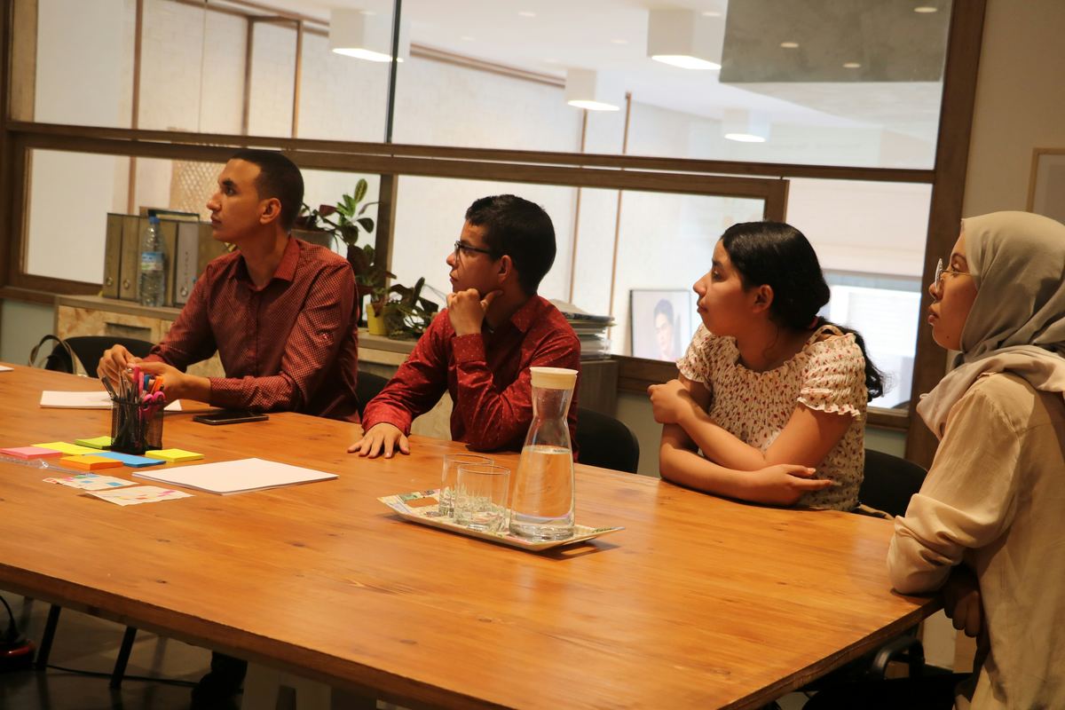 People working together around a table with notes and materials