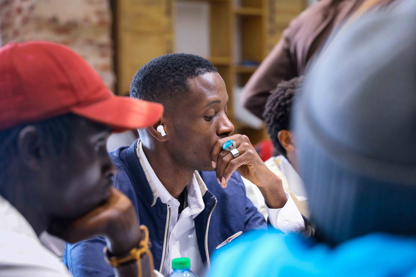 A participant listening during a group discussion